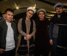 A group of men are posing for a picture together.