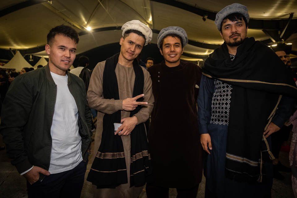 A group of men are posing for a picture together.