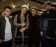 A group of men are posing for a picture together.