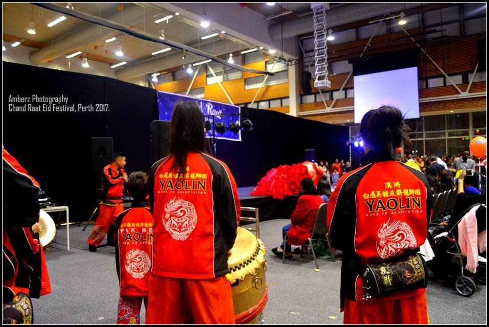 A group of people wearing red jackets that say squis