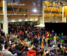 A large crowd of people are gathered in a large room.