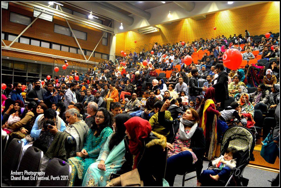 A large crowd of people are sitting in a stadium