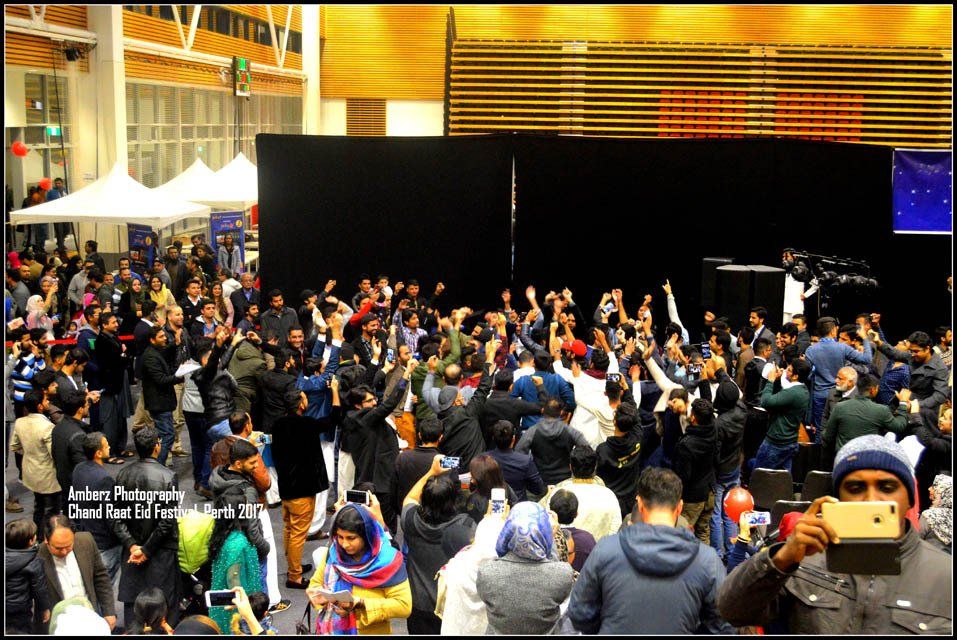 A man is taking a picture of a crowd of people