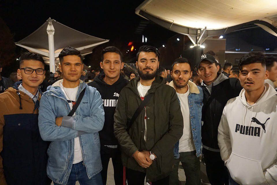 A group of young men are posing for a picture together.