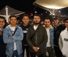 A group of young men are posing for a picture together.