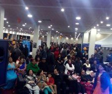 A large group of people are gathered in a large room.