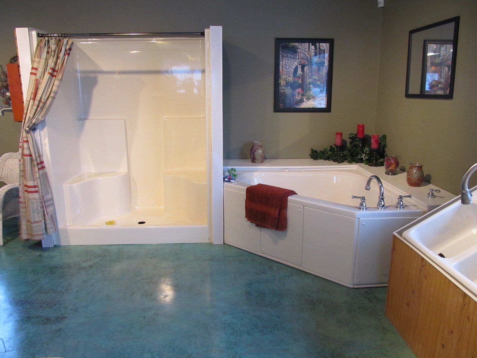 A bathroom with a tub , shower and sink
