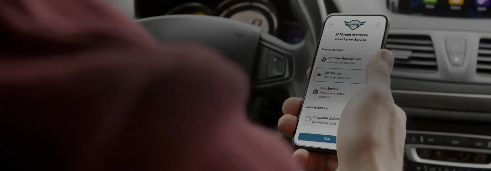 Person holding phone with Live Scheduler on phone | DeMartile Auto Care & Tires