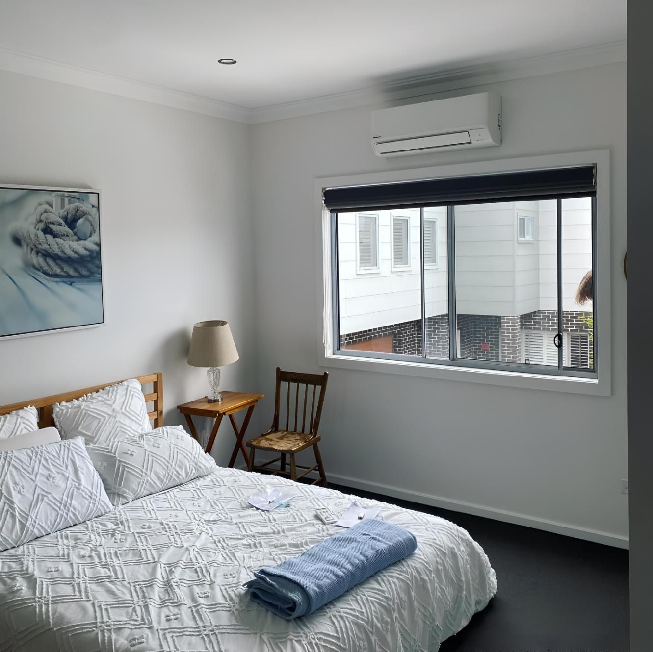 Bedroom With a Large Bed — Kiama Air Conditioning in Kiama, NSW