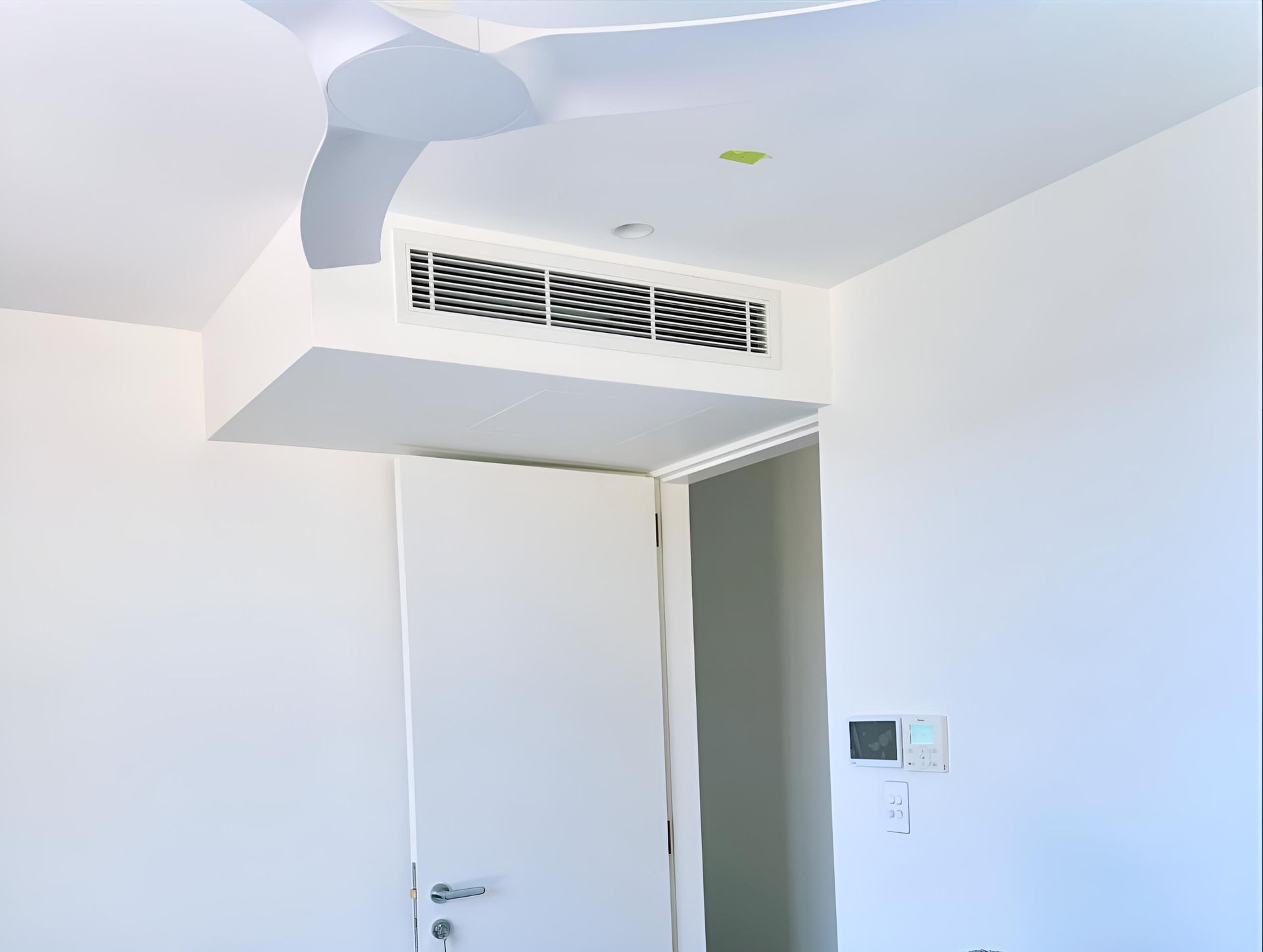White Room With a Ceiling Fan and a Door — Kiama Air Conditioning in Albion Park Rail, NSW