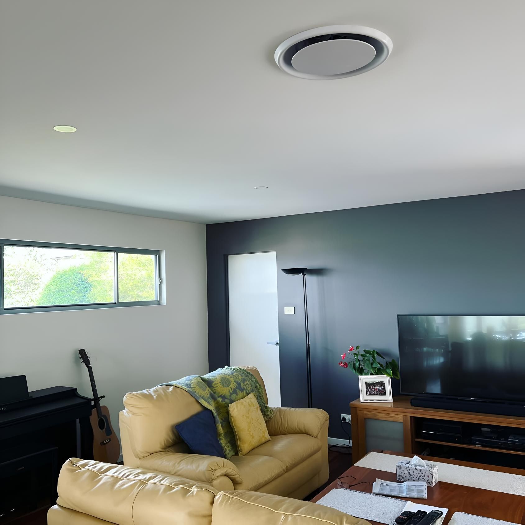Living Room With a Couch and Duct Air Conditioning — Kiama Air Conditioning in Albion Park Rail, NSW