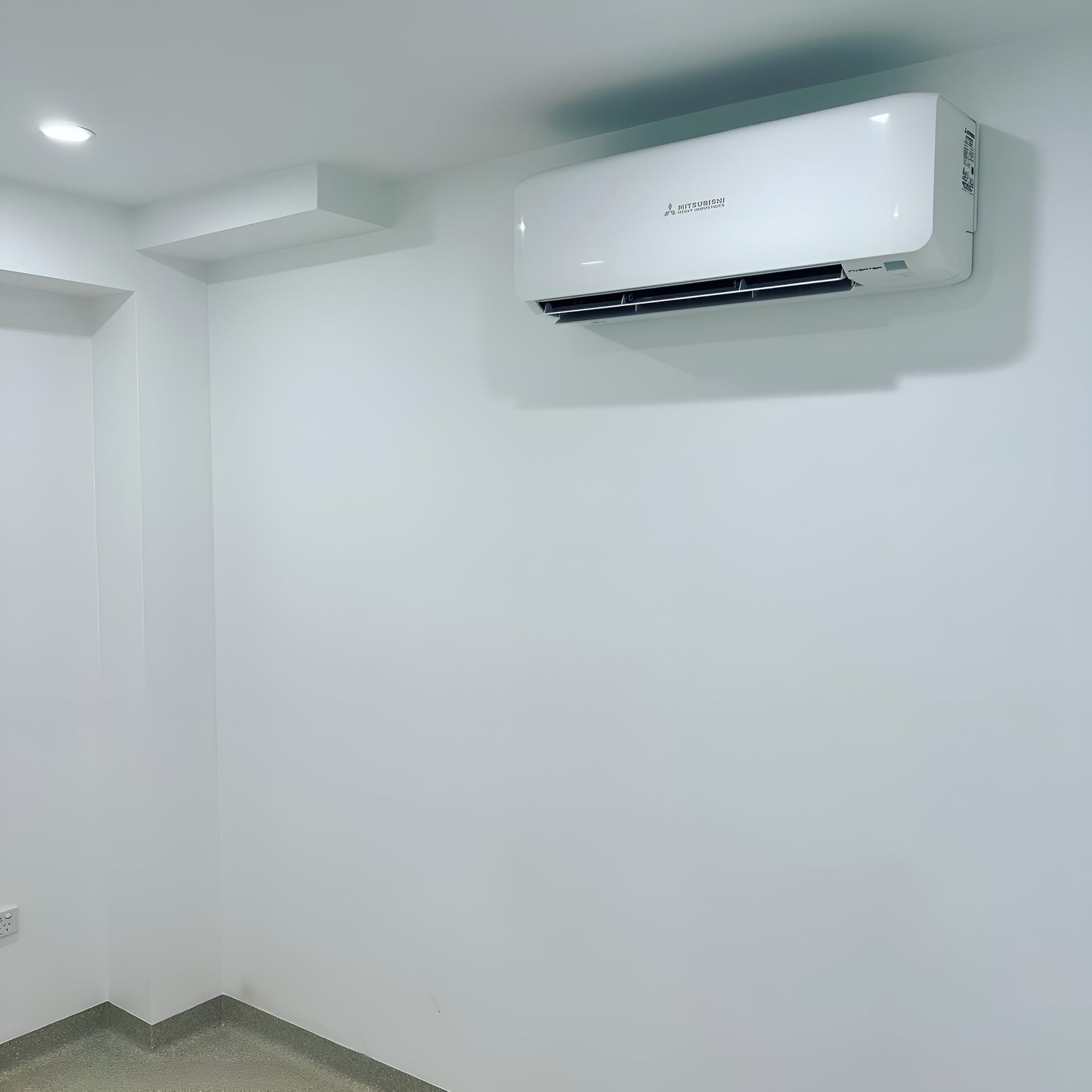 Room With a Wall Mounted Air Conditioner on the Wall — Kiama Air Conditioning in Albion Park Rail, NSW