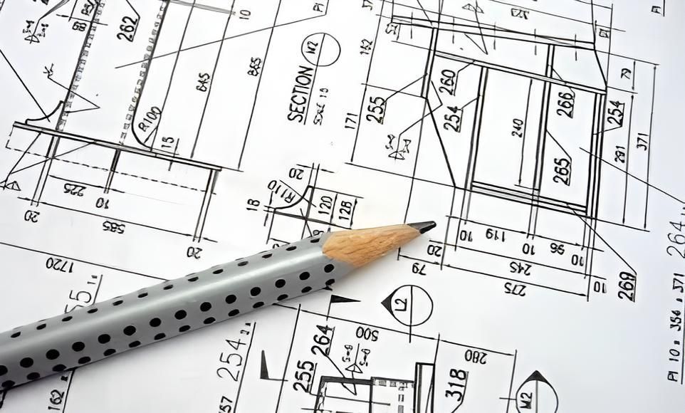 Pencil is Laying on Top of a Drawing of a Building — Kiama Air Conditioning in Albion Park Rail, NSW