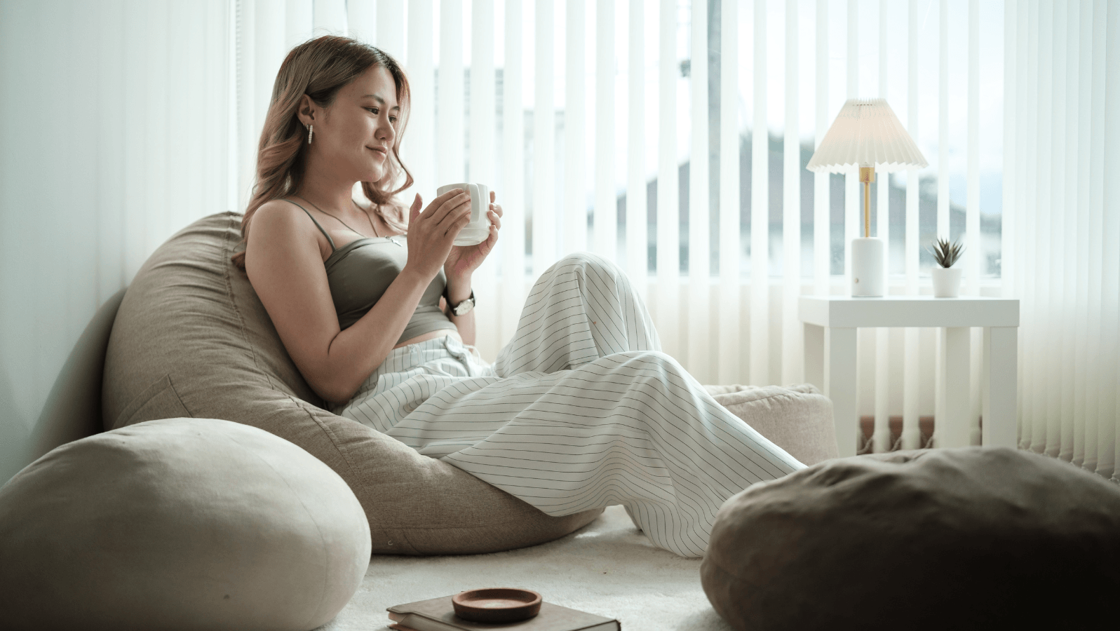 Woman relaxing in the morning with a cup of coffee