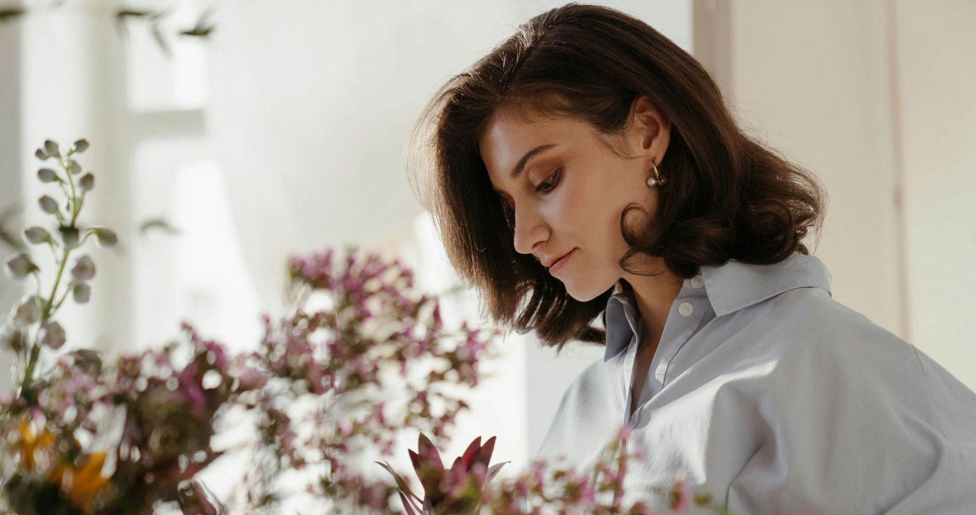 Woman looking at plants.
