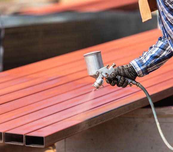 Spraying Paint to Steel Pipe — Powder coating service in Muswellbrook, NSW