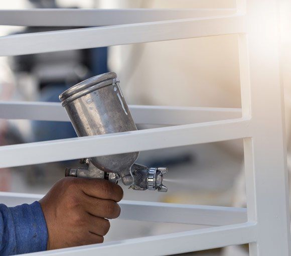 Painting Steel using Spray Gun — Powder coating service in Newcastle, NSW