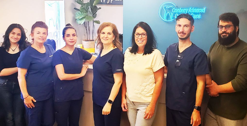 Dental office ad: doctors, staff, text Dental office ad: doctors, staff, text