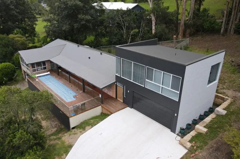 Aerial View of A Modern House Featuring a Swimming Pool — Blue Horizon Projects in Bateau Bay, NSW