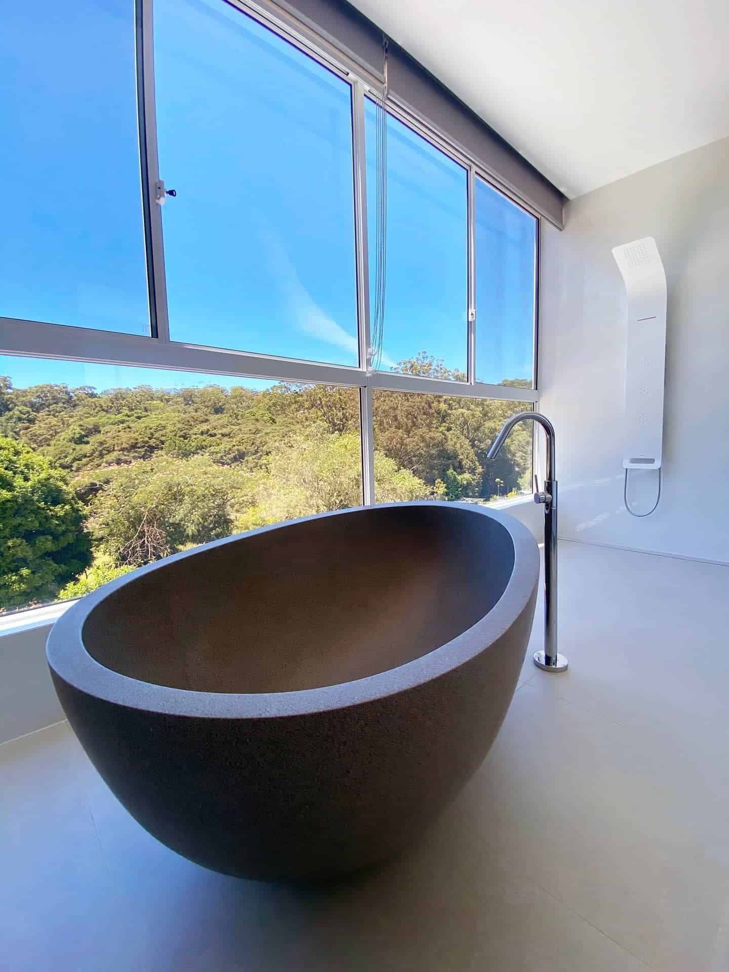A Bathroom with A Large Bathtub and A Large Window — Blue Horizon Projects in Bateau Bay, NSW