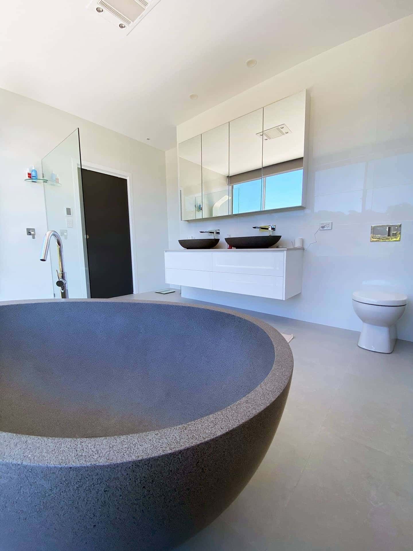 There Is a Large Bathtub in The Middle of The Bathroom — Blue Horizon Projects in Bateau Bay, NSW