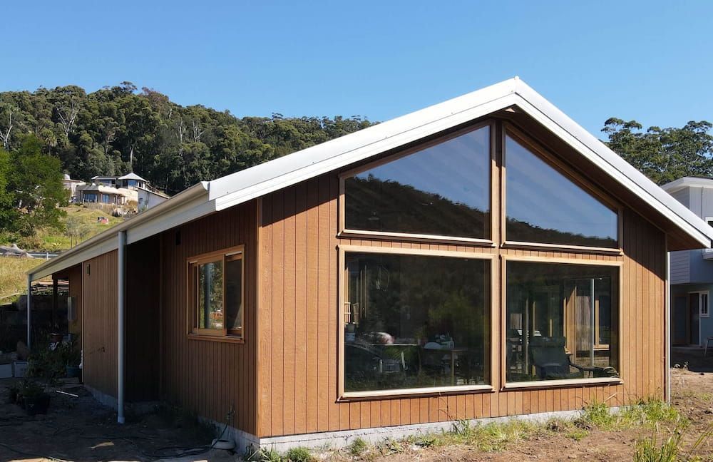 Modern Wooden House with Large Windows — Blue Horizon Projects in Bateau Bay, NSW