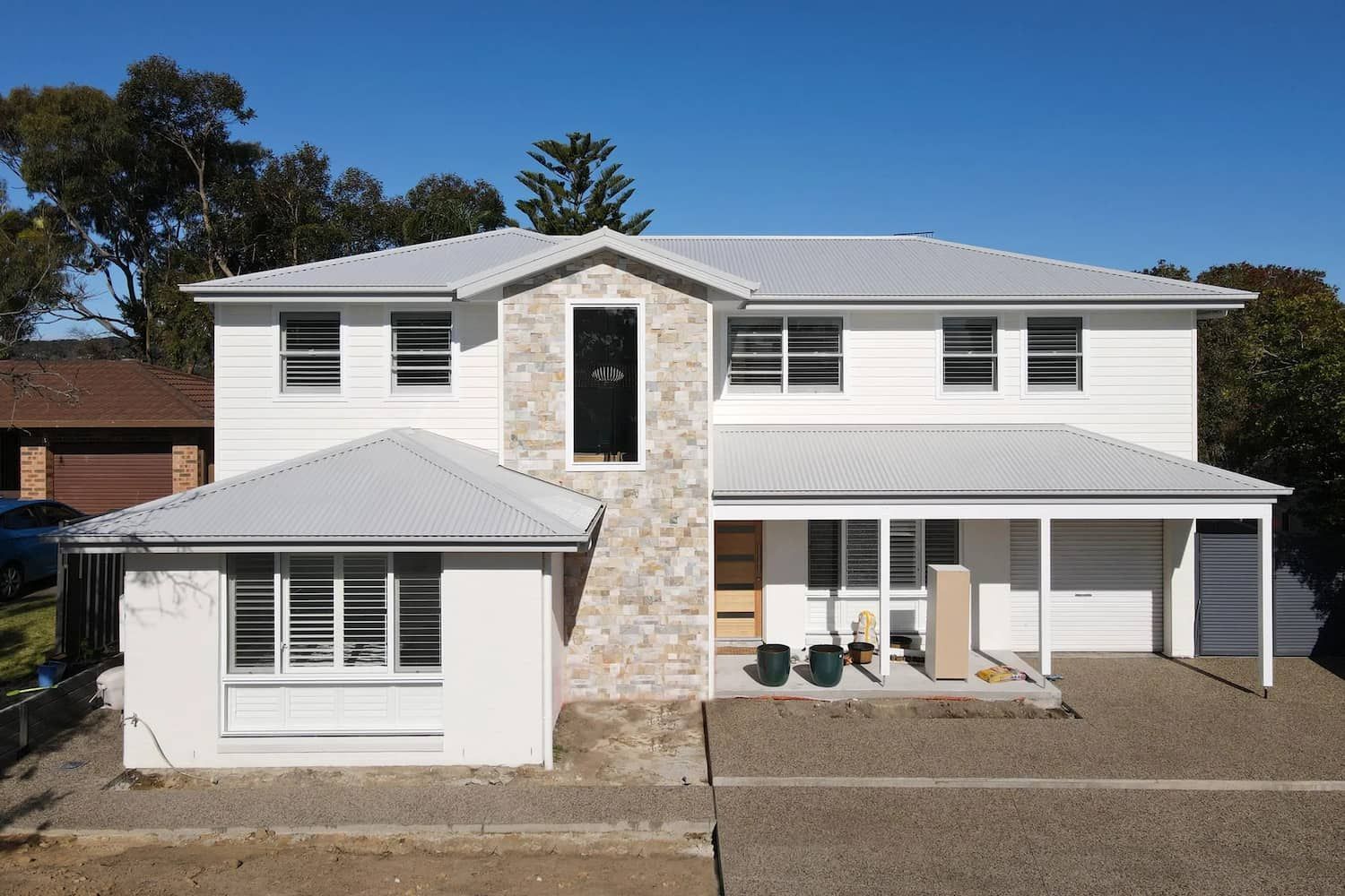 A Large White House with A Porch Is Being Built — Blue Horizon Projects in Bateau Bay, NSW