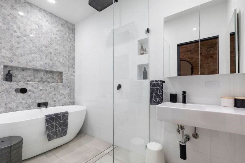 A Bathroom with A Bathtub, Sink, and Walk in Shower — Blue Horizon Projects in Bateau Bay, NSW