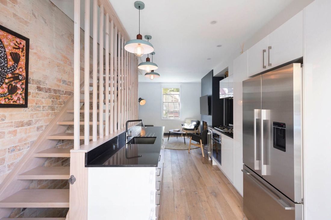 A Modern Kitchen Featuring a Sleek Black Countertop — Blue Horizon Projects in Bateau Bay, NSW