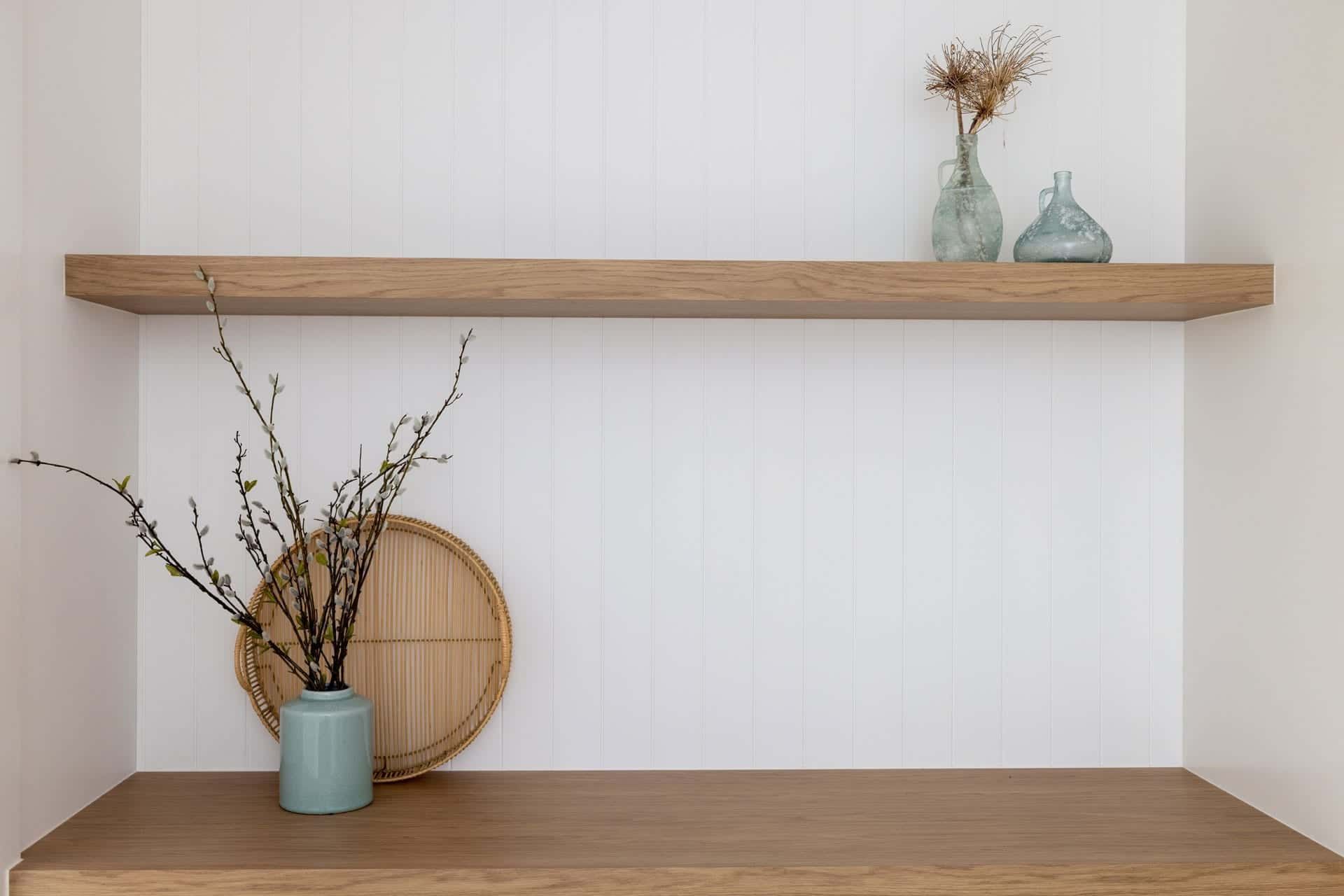 A Wooden Shelf with A Vase of Flowers on It — Blue Horizon Projects in Bateau Bay, NSW