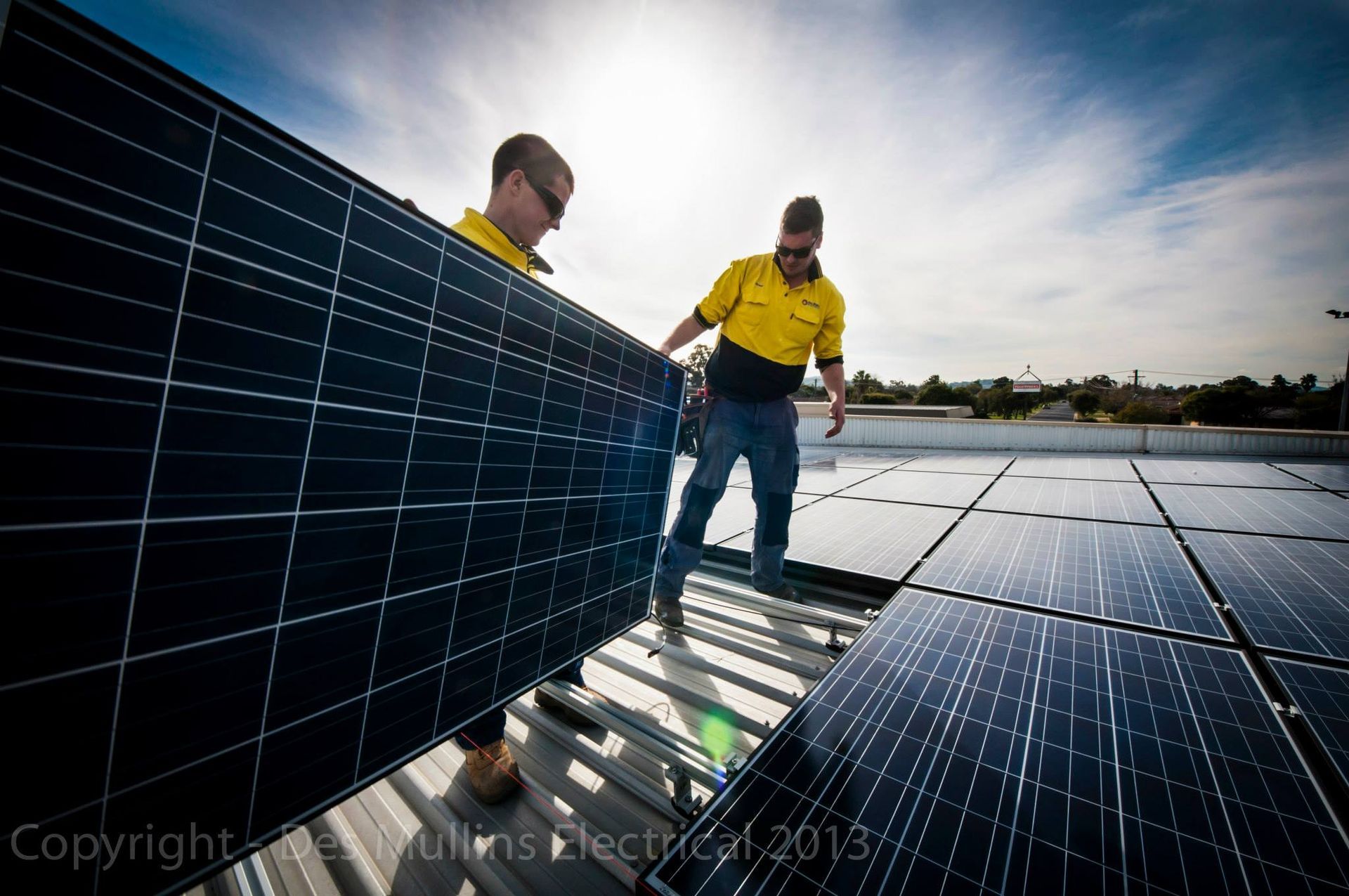 Electrician Fixing Electrical Solar Panel — Des Mullins Electrical & Solar In Wagga Wagga, NSW