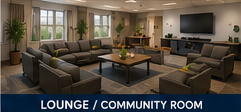 Modern lounge/community room with gray sofas, coffee table, windows, and wall-mounted TV