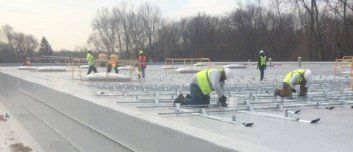 Workers With Safety Vest — Hillburn, NY — Tri-State Commercial Roofing Corp