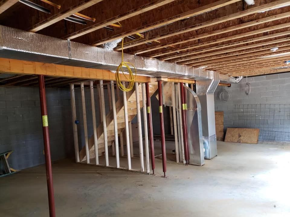 a basement under construction with a staircase being built .