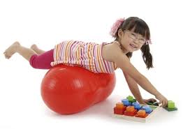 a girls playing with lego-like toys