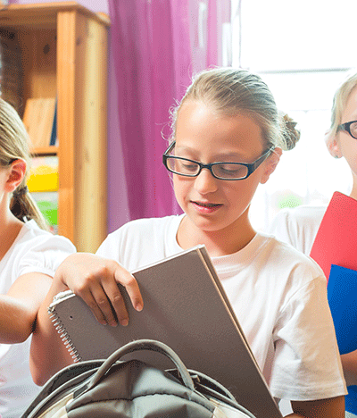 a group of children preparing for school