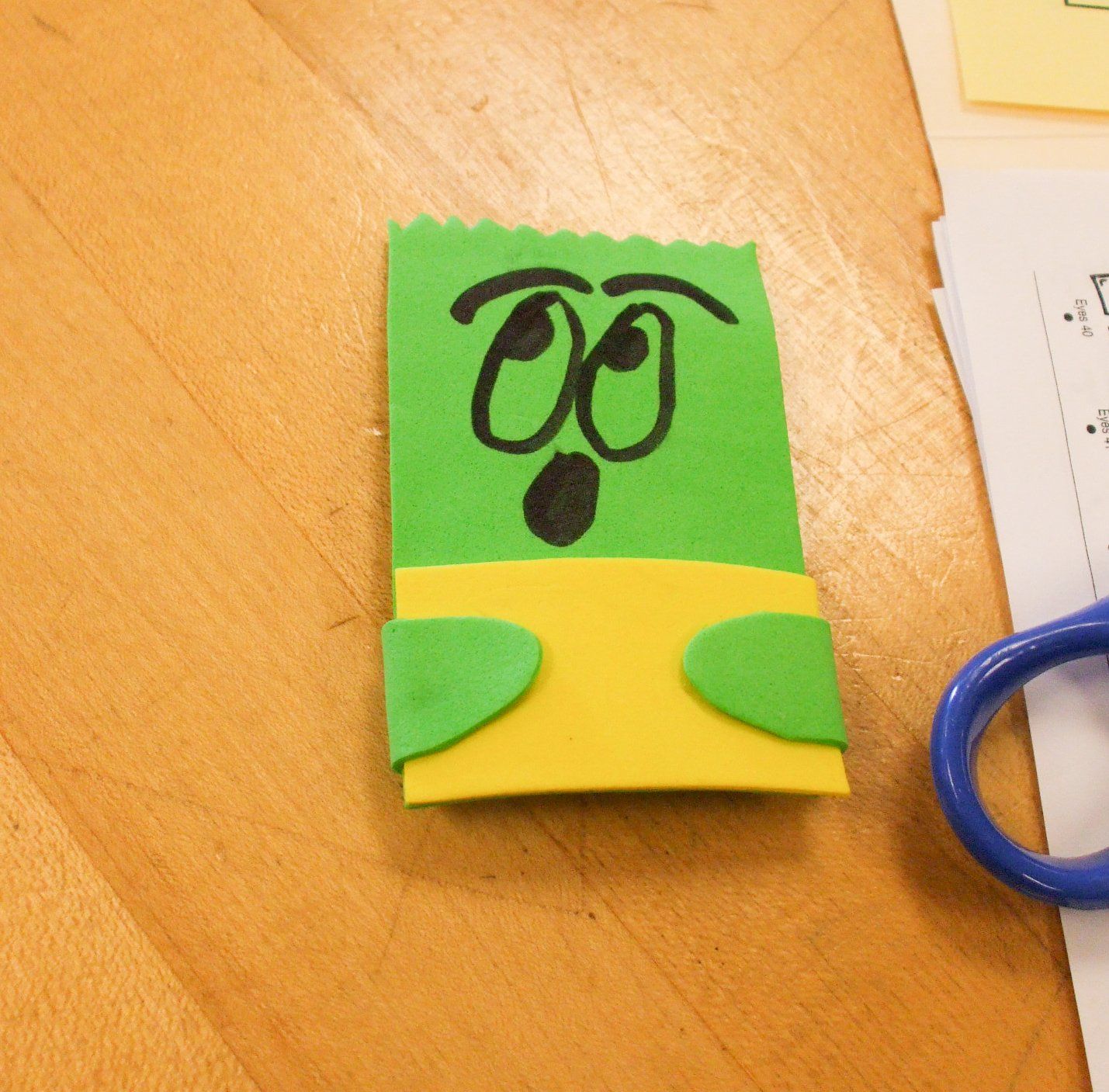 green and yellow finger puppet from workshop