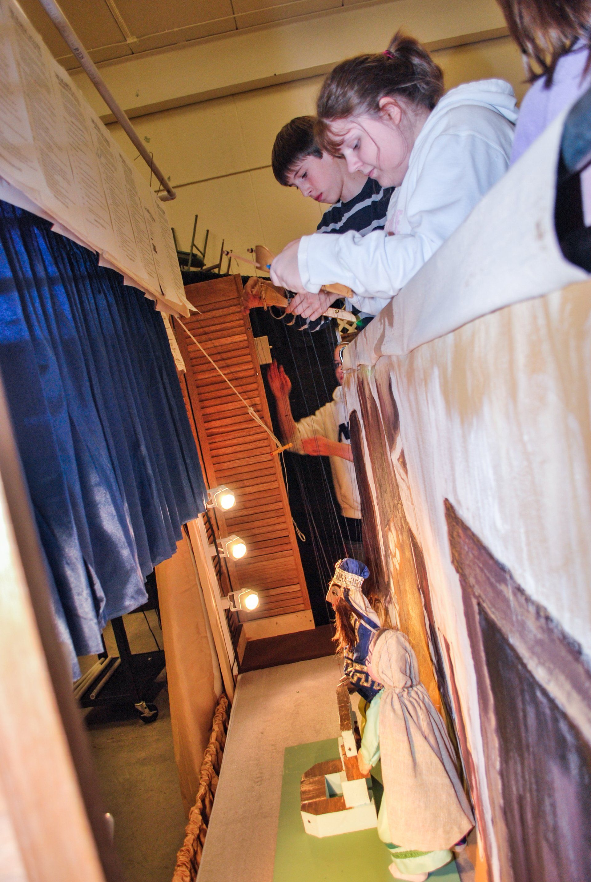 backstage view of puppeteers