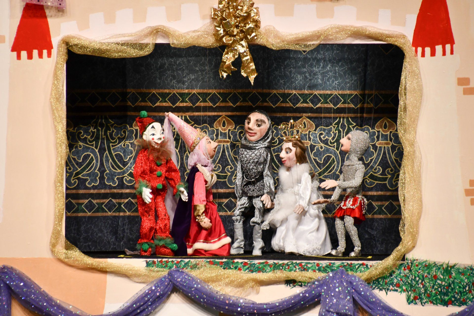 Marionettes on stage - knight - jester - queen - princess