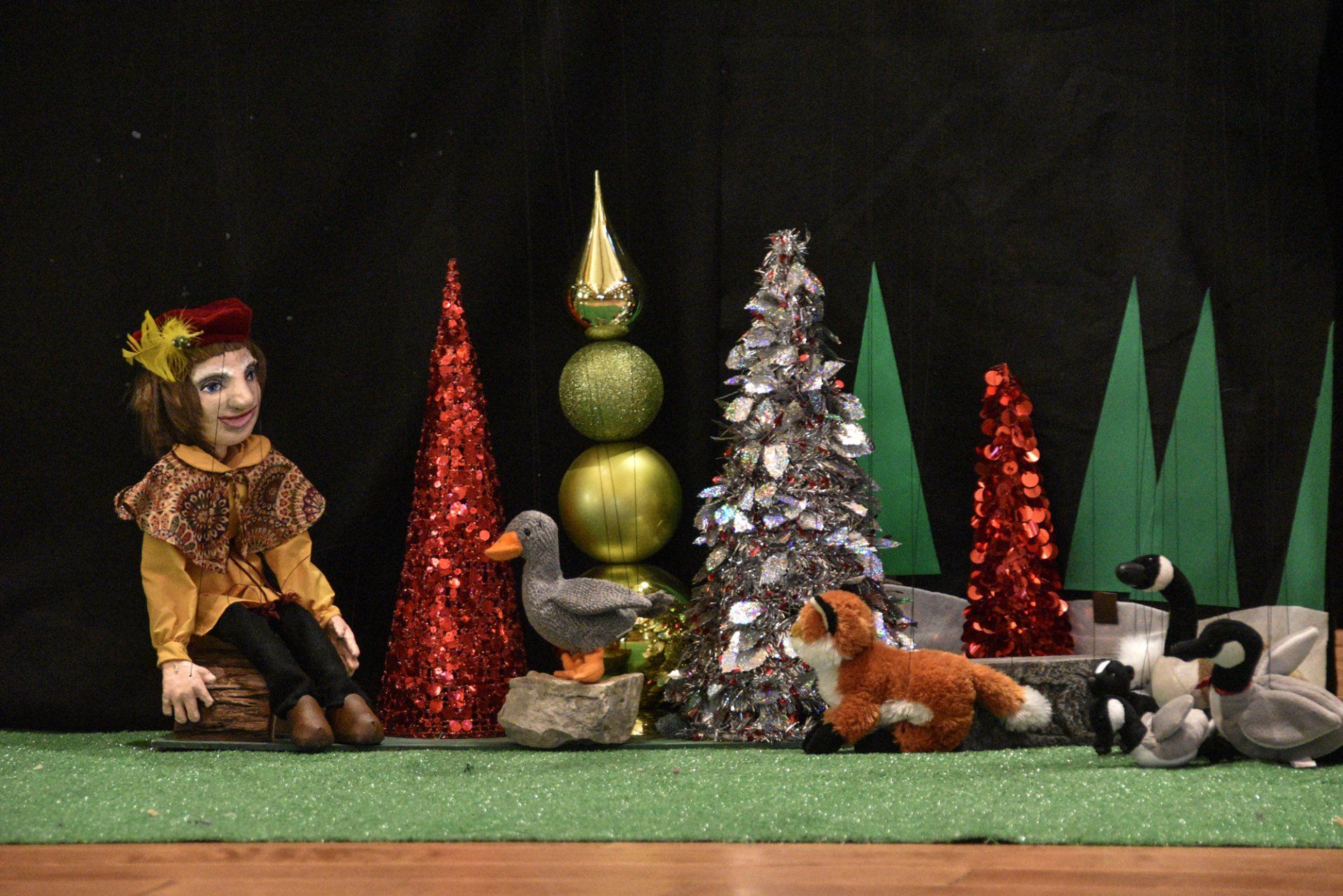Our minstrel marionette visits with woodland creatures in the Enchanted Forest