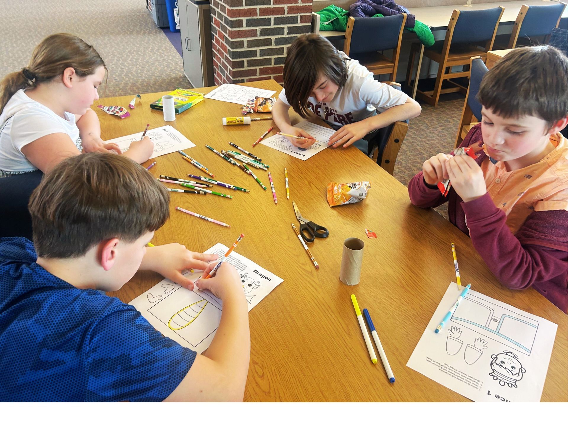 Middle School Students Creating their Paper Roll Puppets