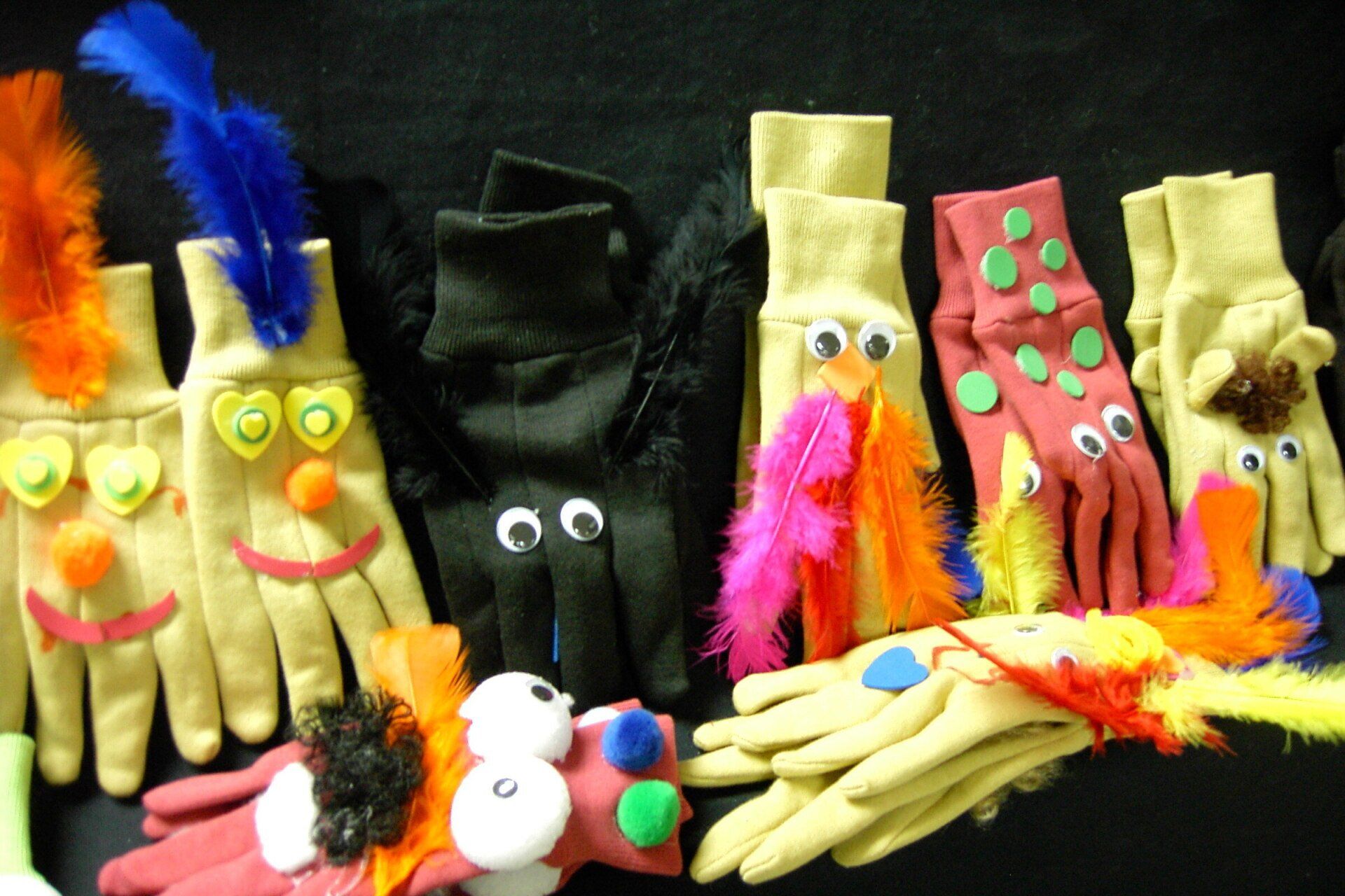 colorful glove puppets created by elementary students at our workshop