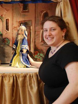 Miss Cassie with Wiseman marionette on stage