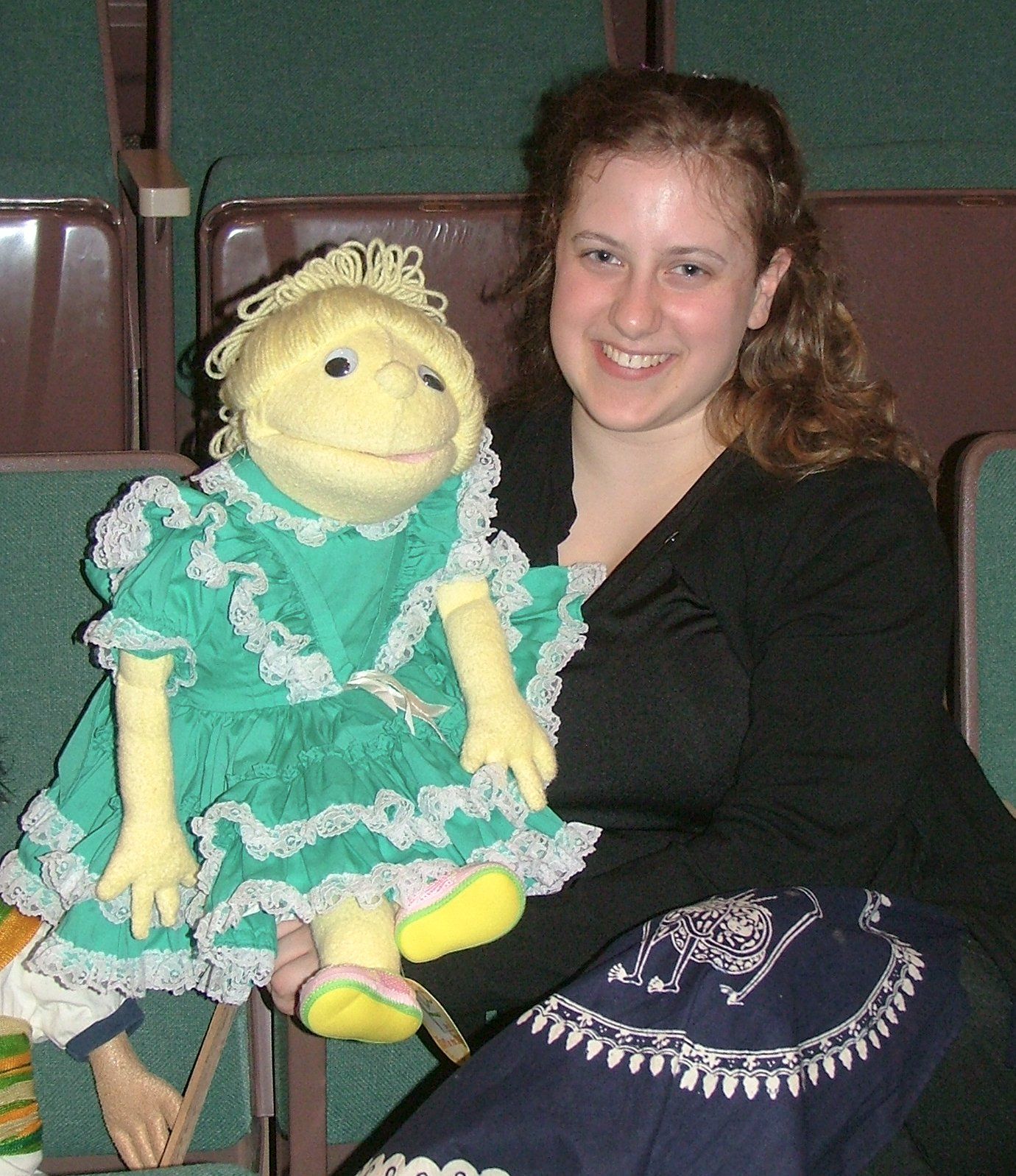 Miss Cassie holds her puppet friend Violet