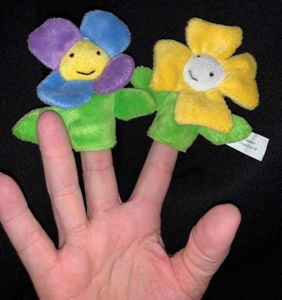 two commercially made flower finger puppets