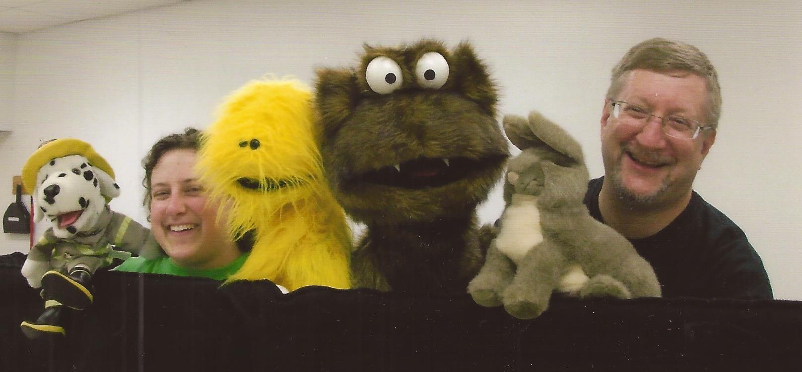 Miss Cassie and Mr. Dave with monster puppet friends