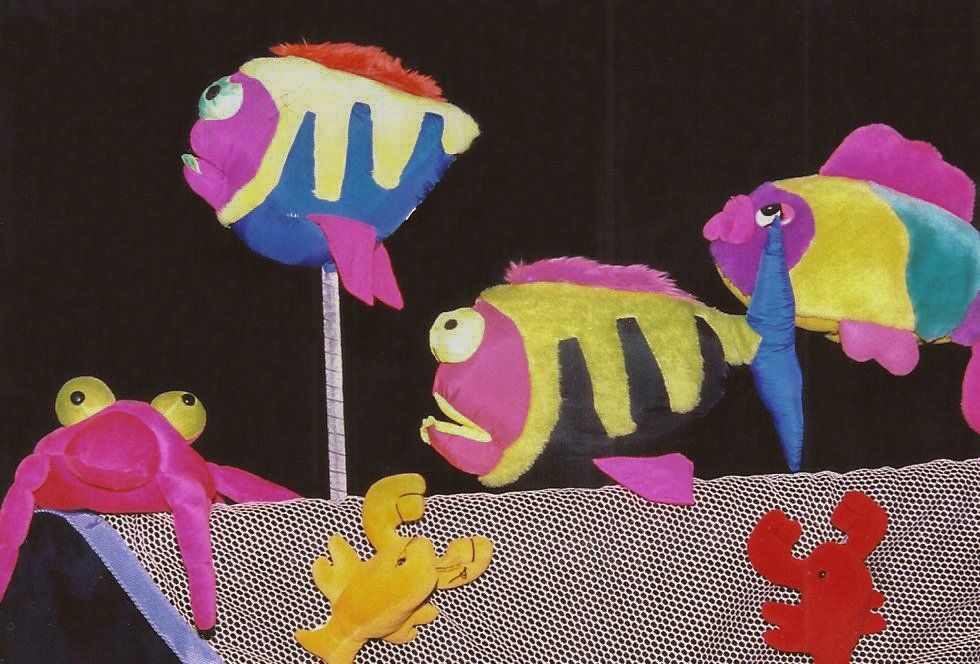 colorful fish puppets mounted on sticks for performance