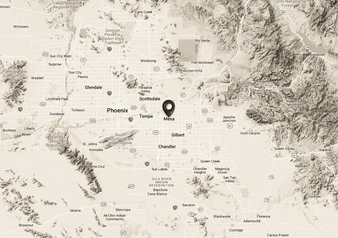 A black and white map of a city with a pin on it.