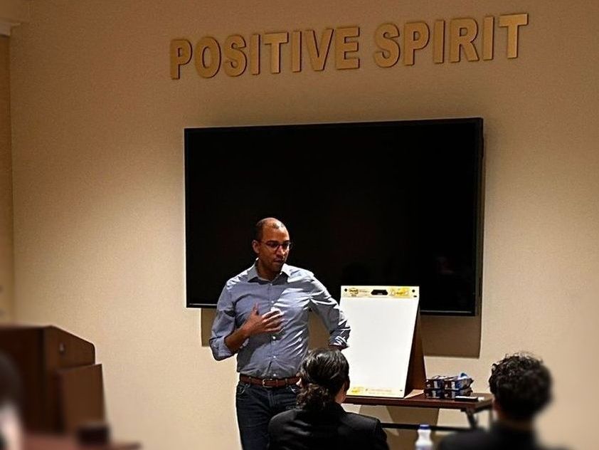 Jevon Gondwe standing out teaching a class on leadership
