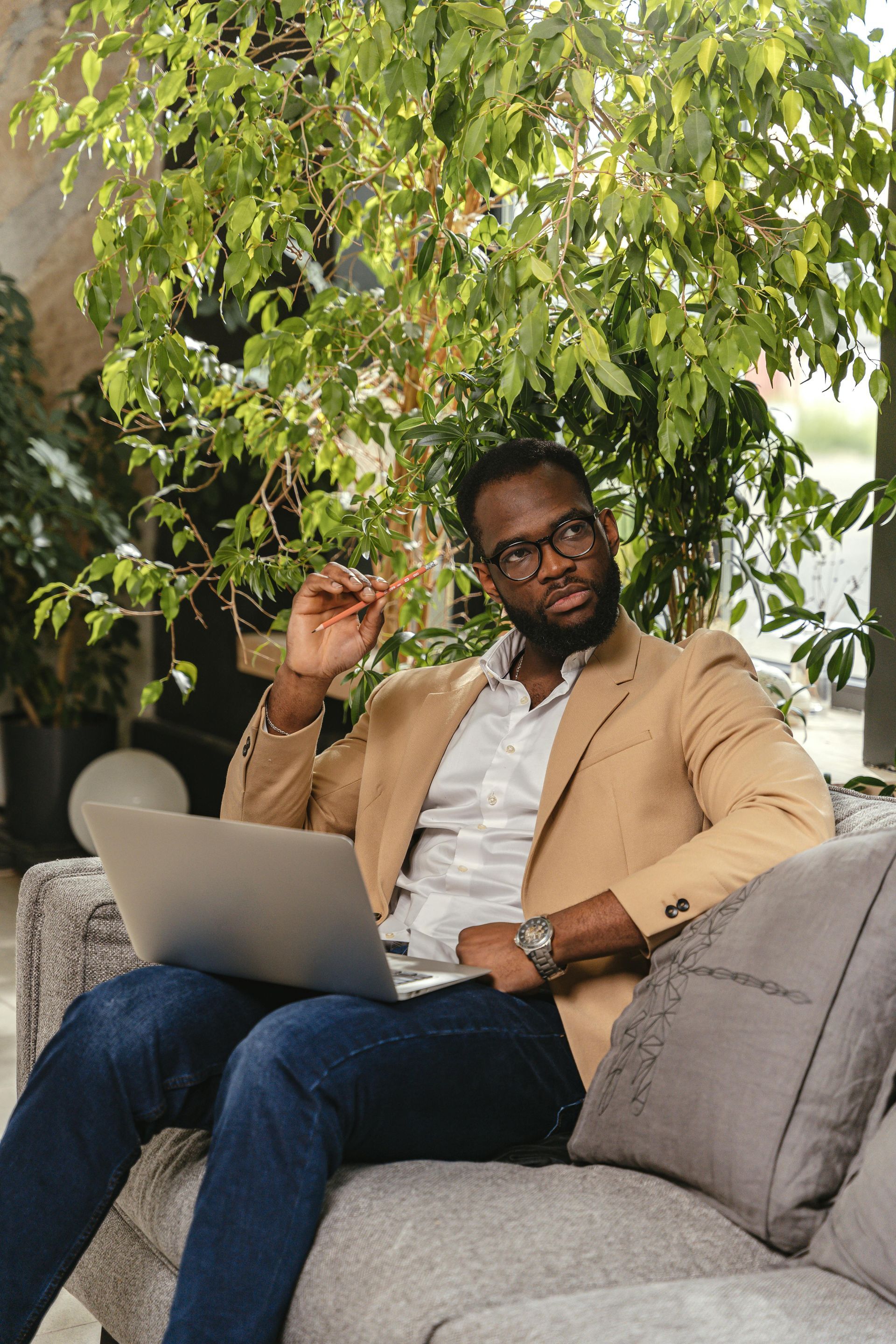 Professional sitting on a couch with classes